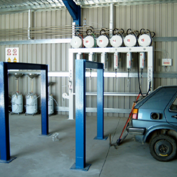 Automotive fluid extraction portico for ELV (End of Life Vehicles)